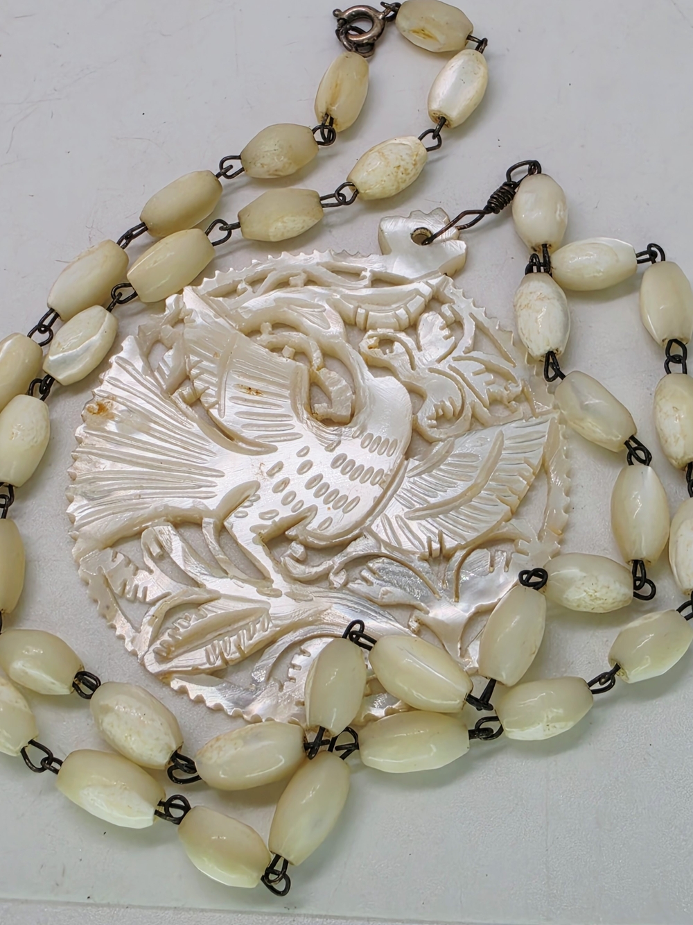 Vtg Carved Mother of Pearl Phoenix Bird Pendant Necklace Hand Linked MOP Beads